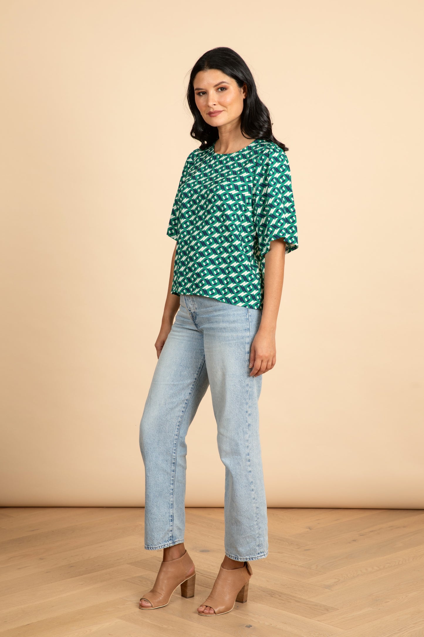 
                  
                    ARCHED Fluted Sleeve Top
                  
                