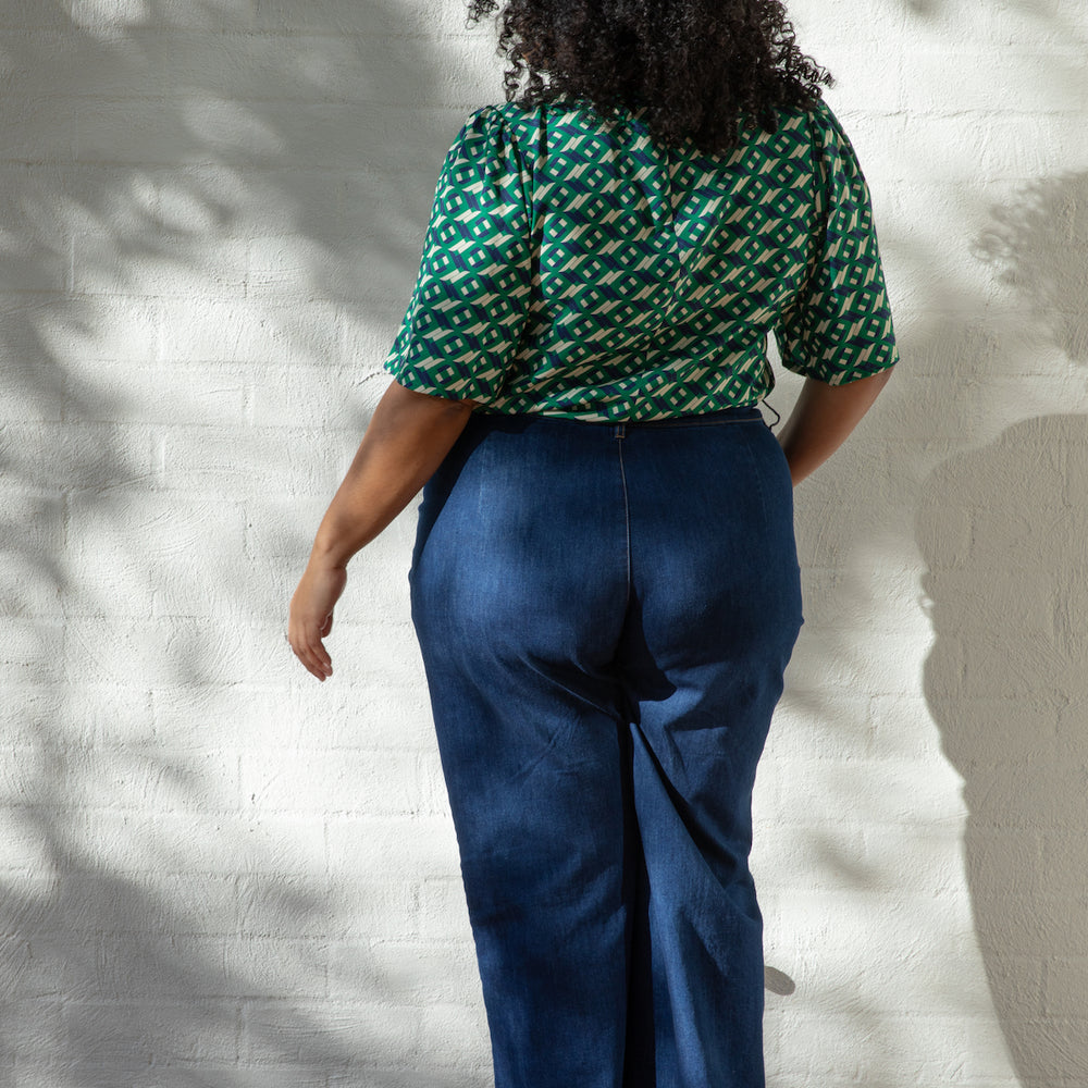 
                      
                        ARCHED Fluted Sleeve Top
                      
                    