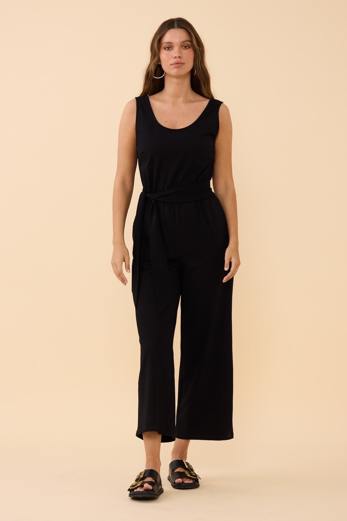 Woman wearing the Frock Me Out Black Sleeveless Stretch Jumpsuit