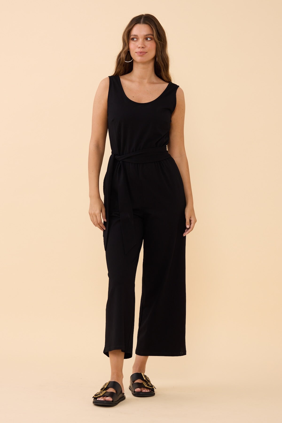 Woman wearing the Frock Me Out Black Sleeveless Stretch Jumpsuit