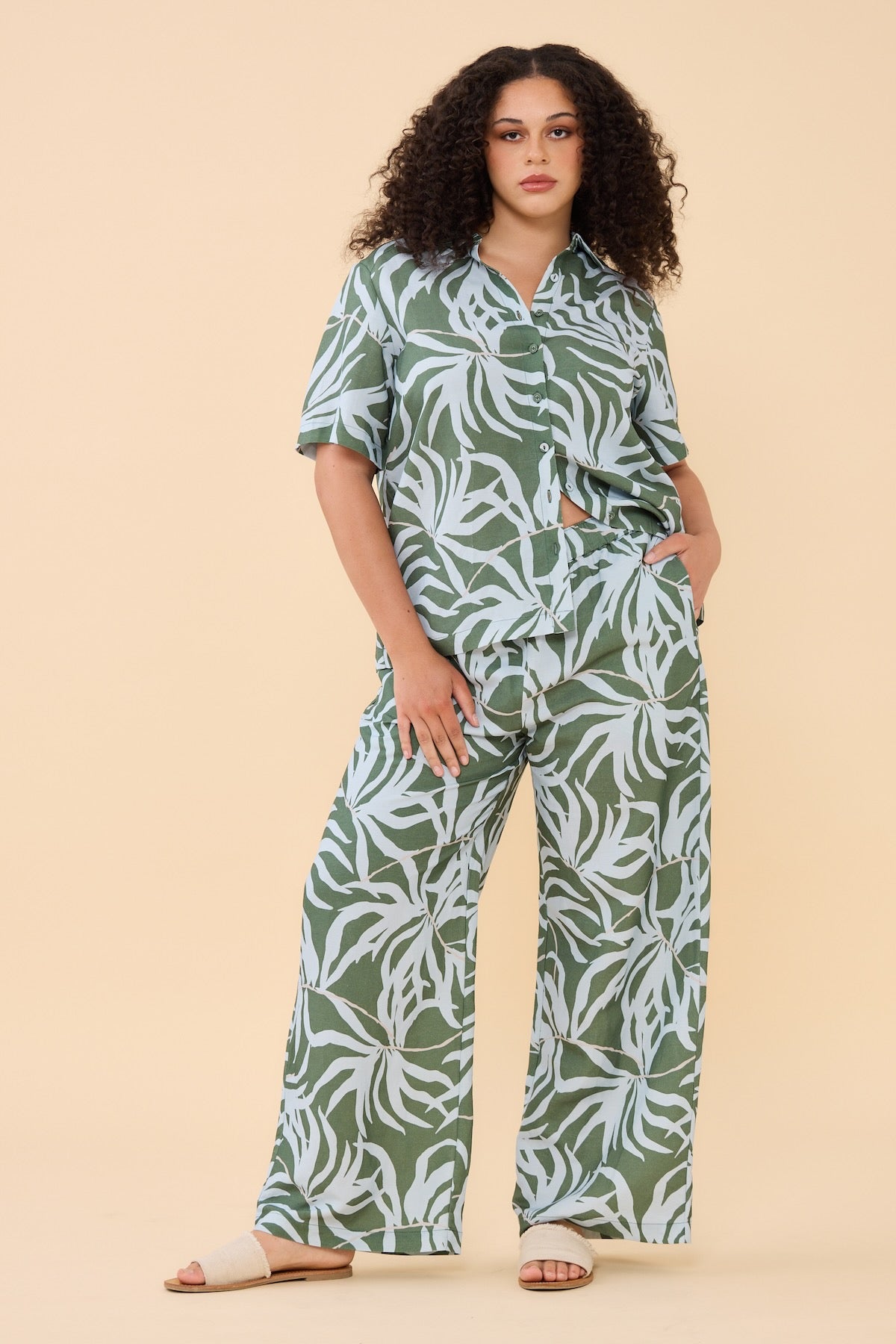 Woman wearing matching Frock Me Out Lets Be Fronds shirt and pants set 