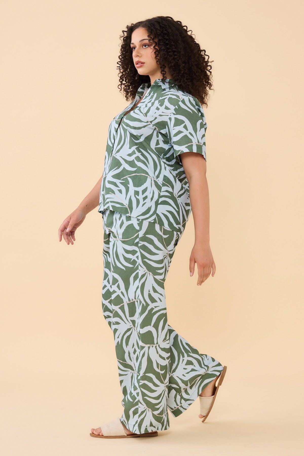 Woman wearing matching Frock Me Out Lets Be Fronds shirt and pants set 