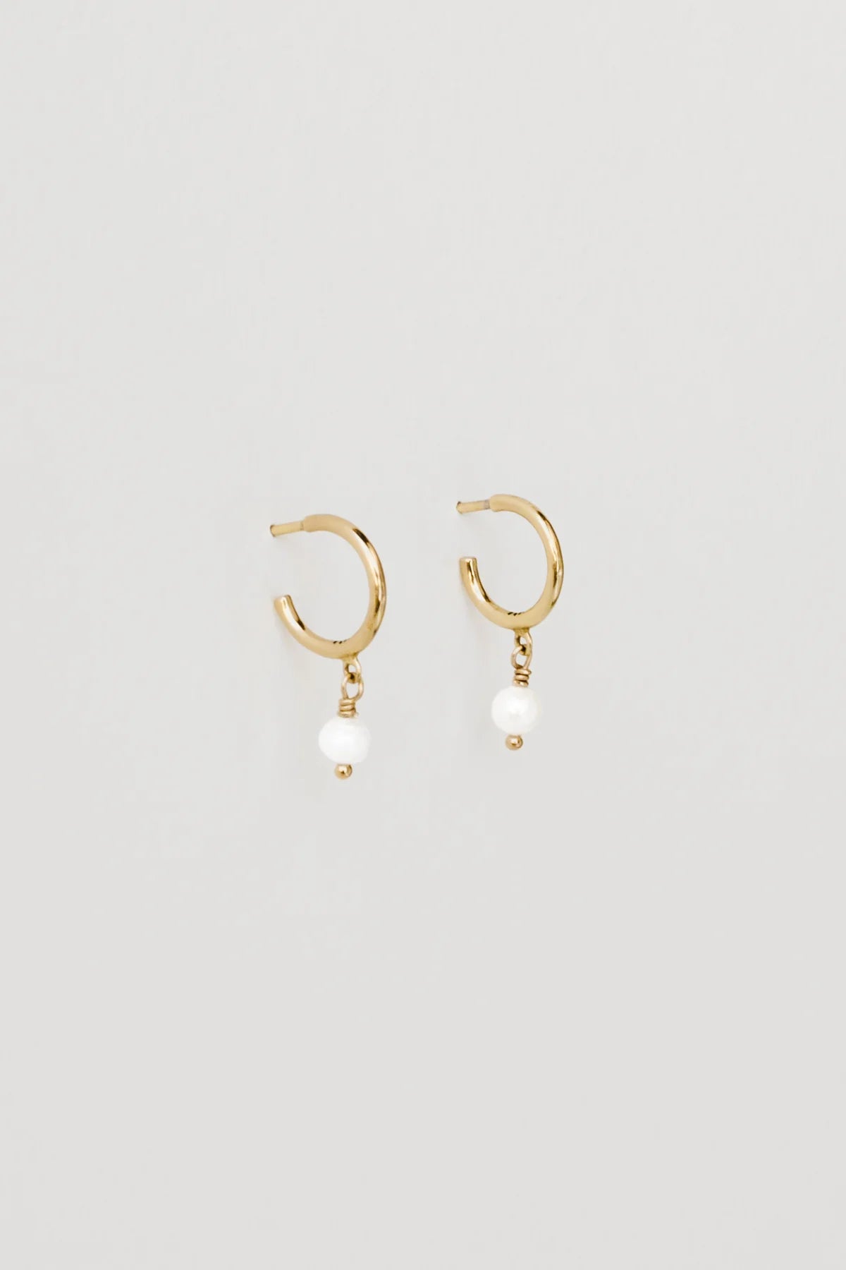 
                  
                    Pearl Charm Hoops by Naomi Murrell
                  
                