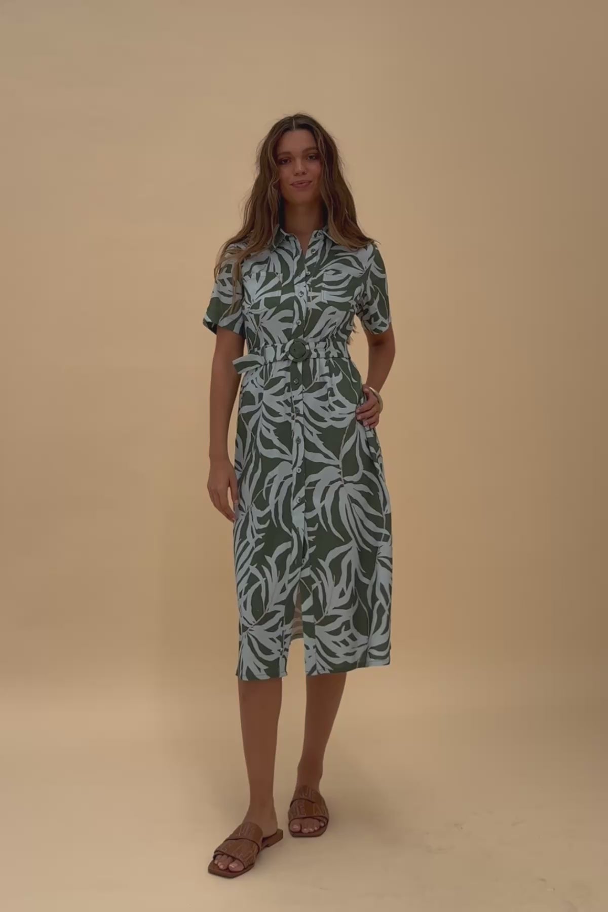 Woman twirling around wearing Frock Me Out LET'S BE FRONDS Shirt Dress