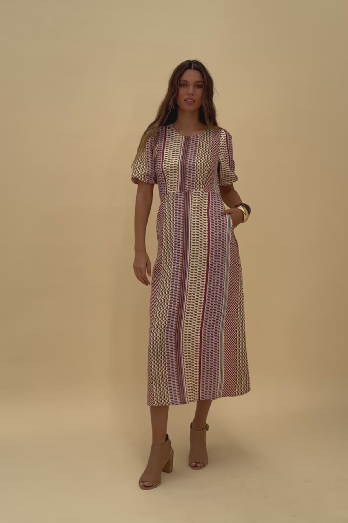 Woman wearing Frock Me Out Resort Mod Shapeshifter Dress Twirling around