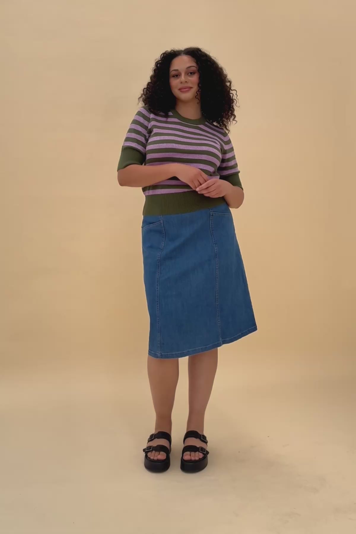 Woman posing wearing the Frock Me Out GREEN and DISCO LILAC Stripe Knit